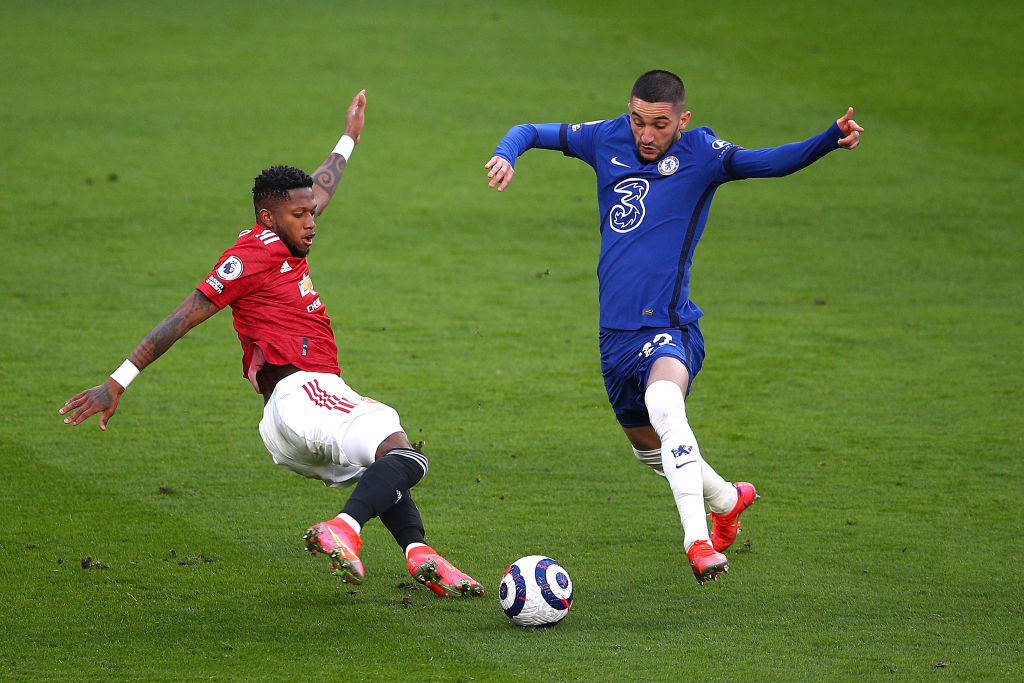 Hakim Ziyech of Chelsea battles for possession with Fred of Manchester United during the Premier League match between Chelsea and Manchester United...