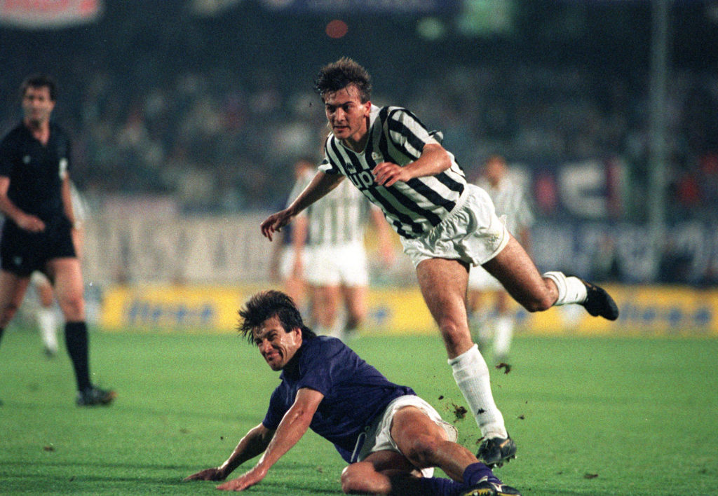 Football. UEFA Cup Final, Second Leg. Florence, Italy. 16th May 1990. Fiorentina 0 v Juventus 0 (Juventus win 3-1 on aggregate). Fiorentina's Carlos Dunga slides to tackle Pierluigi Casiraghi of Juventus.