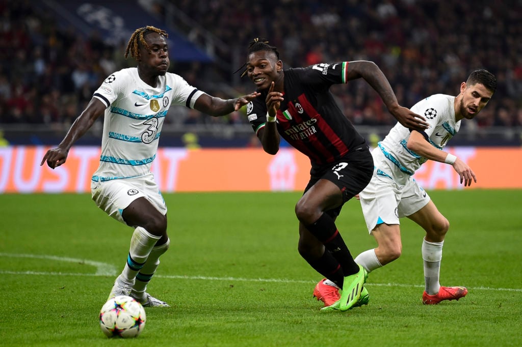 Rafael Leao (C) of AC Milan competes for the ball with