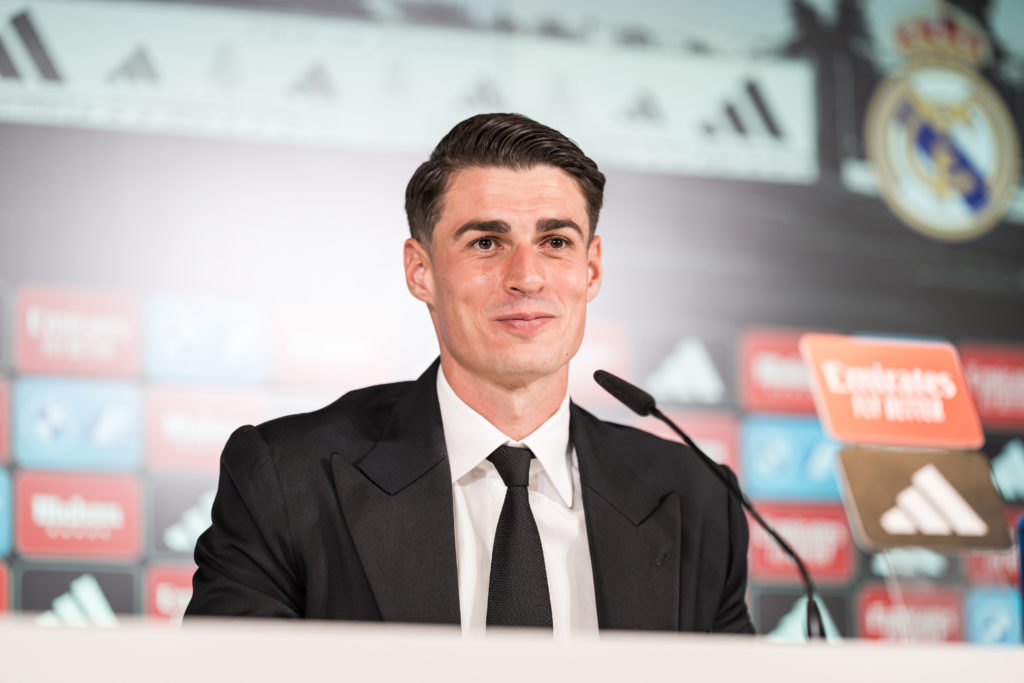 Kepa Arrizabalaga smiles in front of the media in the Real...