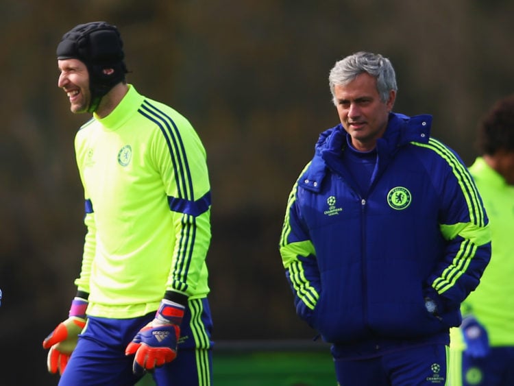 Jose Mourinho manager of Chelsea (R) and goalkeeper Petr Cech (2R) smile during a Chelsea training session ahead of the UEFA Champions League Round...
