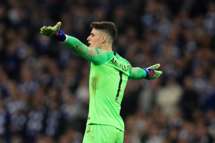 Kepa Arrizabalaga of Chelsea reacts as Maurizio Sarri tries to substitute him during the Carabao Cup Final between Chelsea and Manchester City at W...