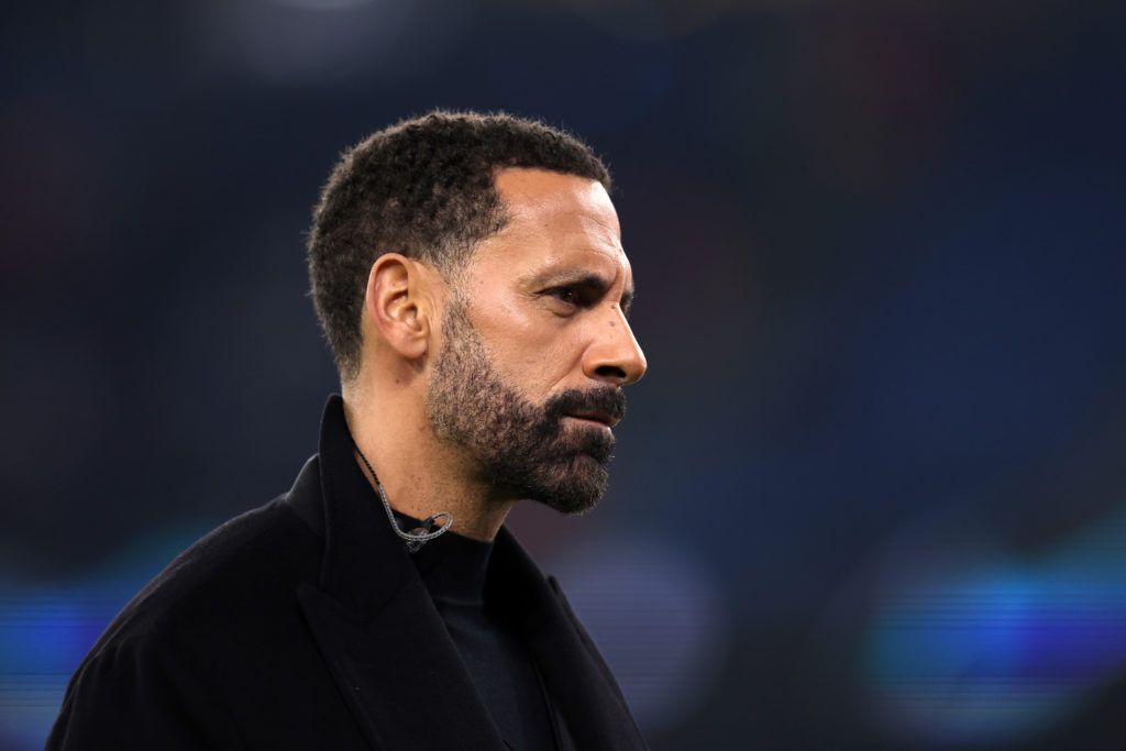 Rio Ferdinand working as a pundit for a Champions League match.