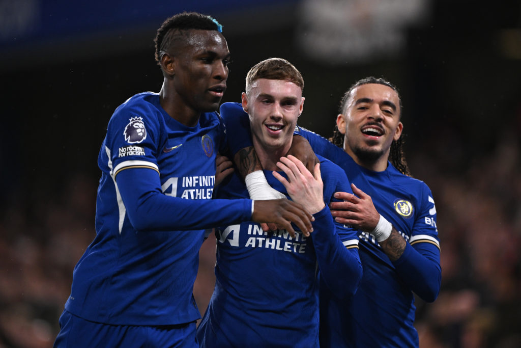 Cole Palmer of Chelsea celebrates with Nicolas Jackson and Malo Gusto after opening the scoring during the Premier League match between Chelsea FC ...