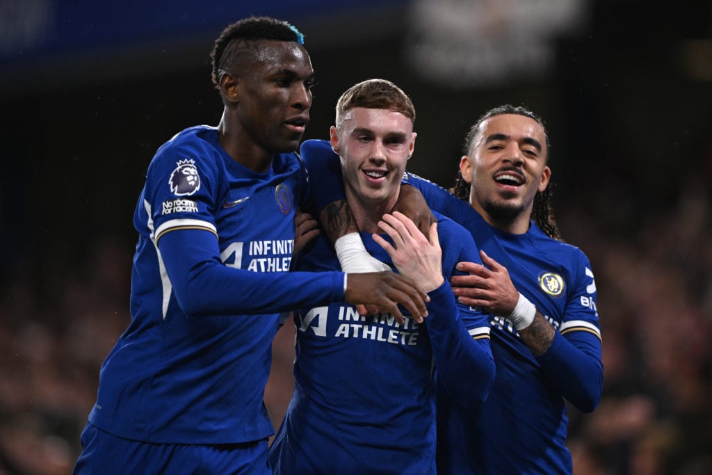 Cole Palmer of Chelsea celebrates with Nicolas Jackson and Malo Gusto after opening the scoring during the Premier League match between Chelsea FC ...