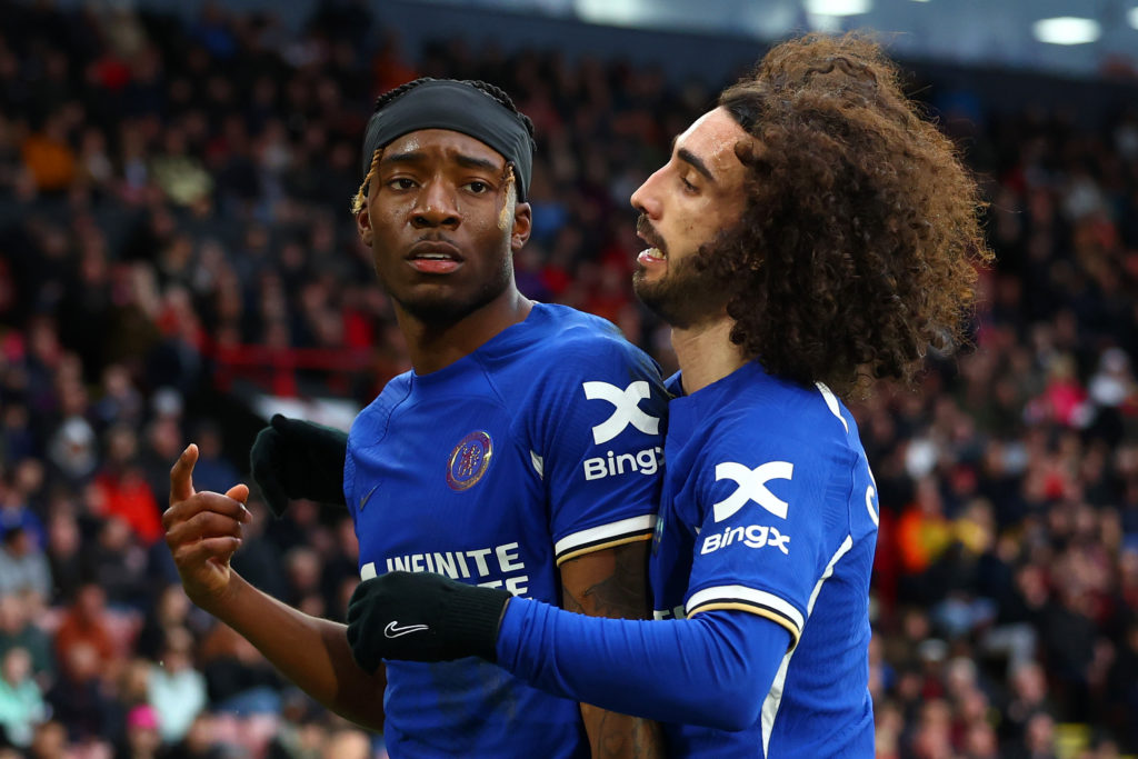 Noni Madueke of Chelsea celebrates scoring his side's second goal with team-mate Marc Cucurella during the Premier League match between Sheffield U...