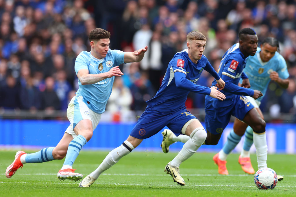 Cole Palmer of Chelsea competes with Julian Alvarez of Manchester City during the Emirates FA Cup Semi Final match between Manchester City and Chel...