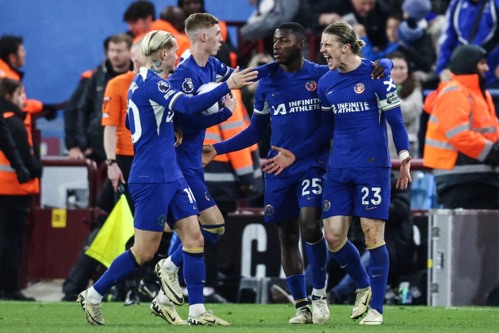 Chelsea's English midfielder #23 Conor Gallagher (R) celebrates after scoring his team second goal during the English Premier League football match...