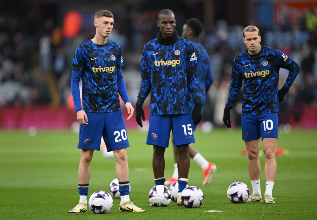 (L-R) Cole Palmer, Nicolas Jackson and Mykhaylo Mudryk of Chelsea look on during their warm up prior to the Premier League match between Aston Vill...