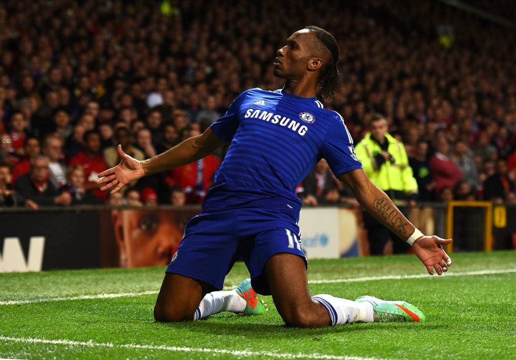 Didier Drogba of Chelsea celebrates scoring the first goal during the Barclays Premier League match between Manchester United and Chelsea at Old Tr...