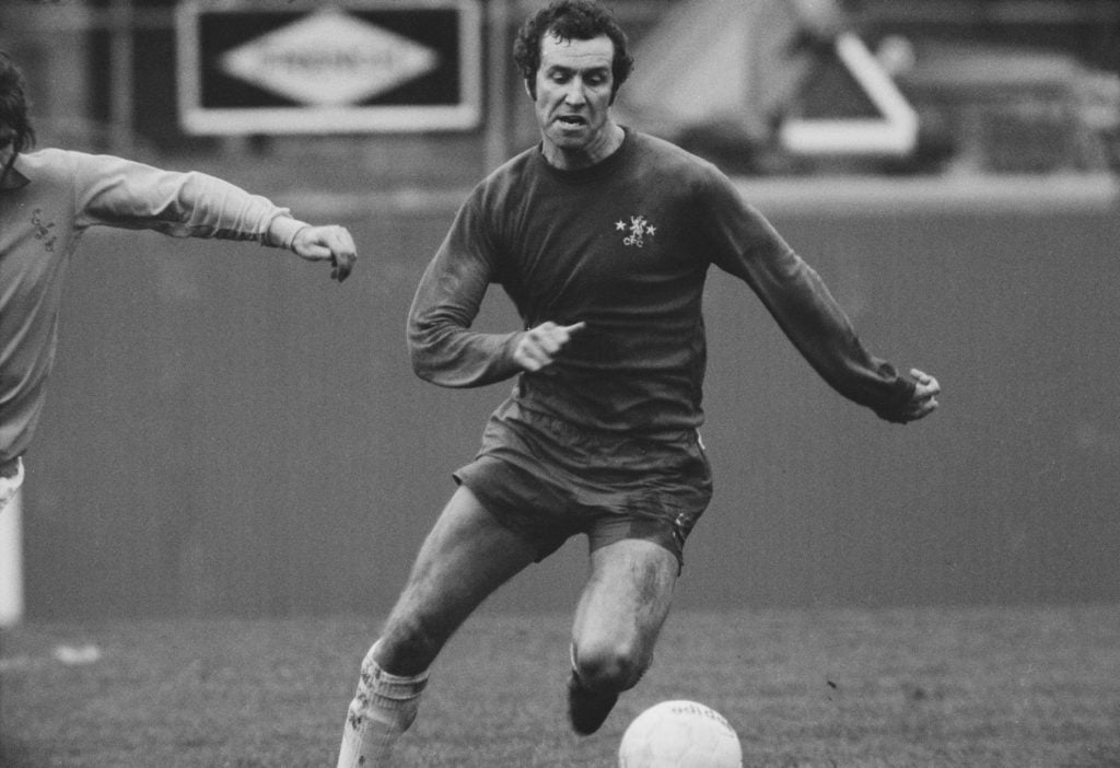 English professional footballer and forward with Chelsea FC, Peter Osgood (1947-2006) pictured with the ball during play in the League Division One...