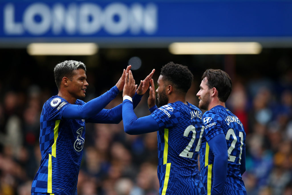 Reece James celebrates with Thiago Silva and Ben Chilwell of Chelsea after scoring their team's third goal during the Premier League match between ...