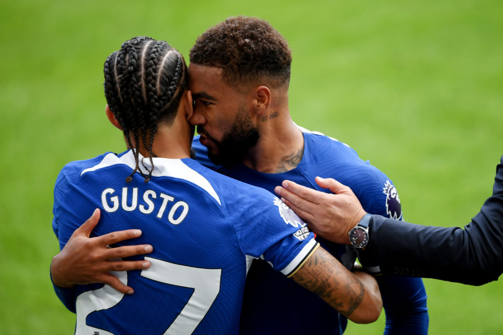 Malo Gusto of Chelsea is embraced by Reece James during the Premier League match between Chelsea FC and Liverpool FC at Stamford Bridge on August 1...