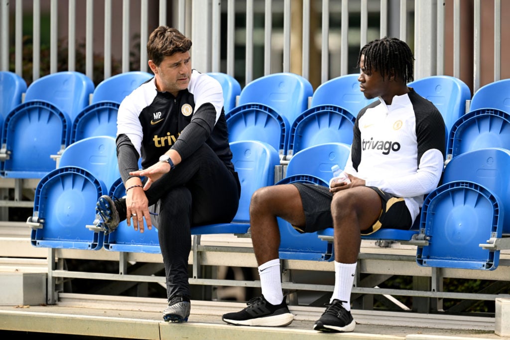 Head Coach Mauricio Pochettino and Romeo Lavia of Chelsea during a training session at the Chelsea Training Ground on August 24, 2023 in Cobham, En...