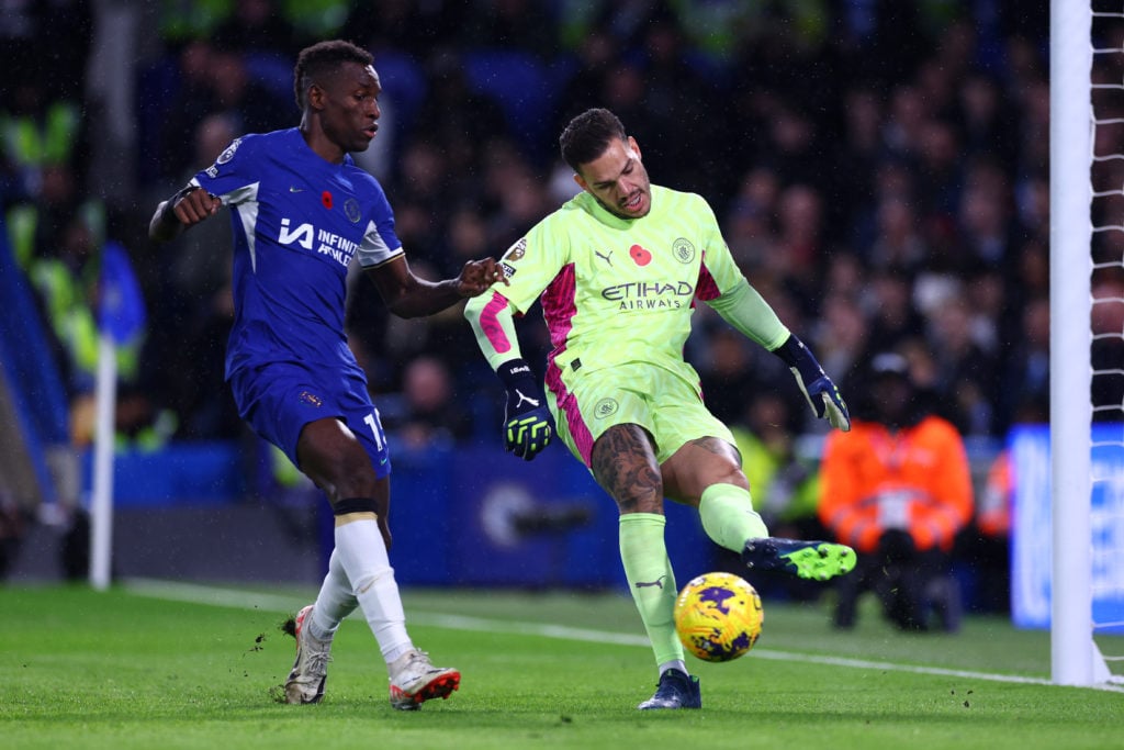 Ederson of Manchester City controls the ball whilst under pressure from Nicolas Jackson of Chelsea during the Premier League match between Chelsea ...