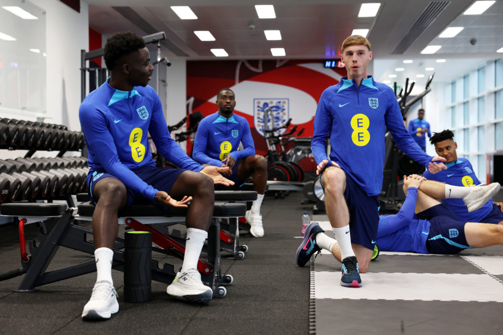 Bukayo Saka and Cole Palmer of England speak during an England Gym Session at St George's Park on November 14, 2023 in Burton upon Trent, England.