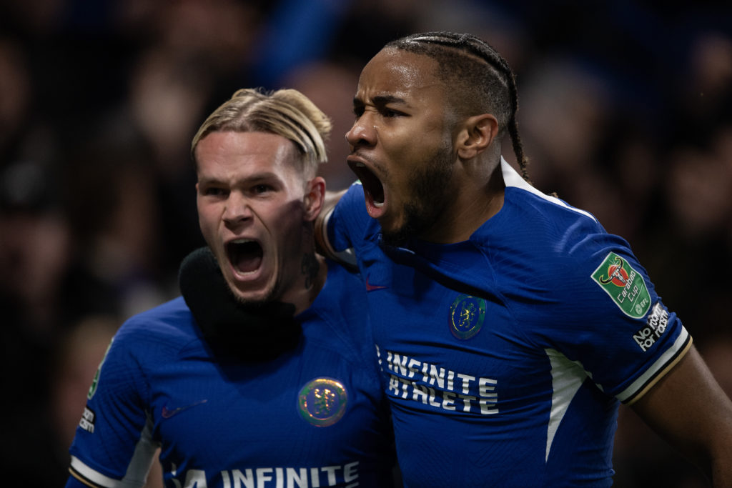 Mykhailo Mudryk of Chelsea (left) celebrates his goal with Christopher Nkunku during the Carabao Cup Quarter Final match between Chelsea and Newcas...