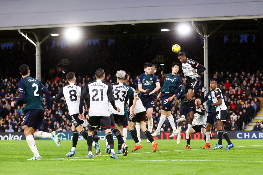 Tosin Adarabioyo of Fulham wins a header whilst under pressure from Takehiro Tomiyasu of Arsenal during the Premier League match between Fulham FC ...
