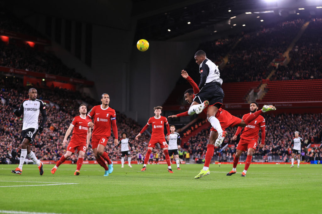 Tosin Adarabioyo of Fulham out jumps Ryan Gravenberch of Liverpool during the Carabao Cup Semi Final First Leg match between Liverpool and Fulham a...