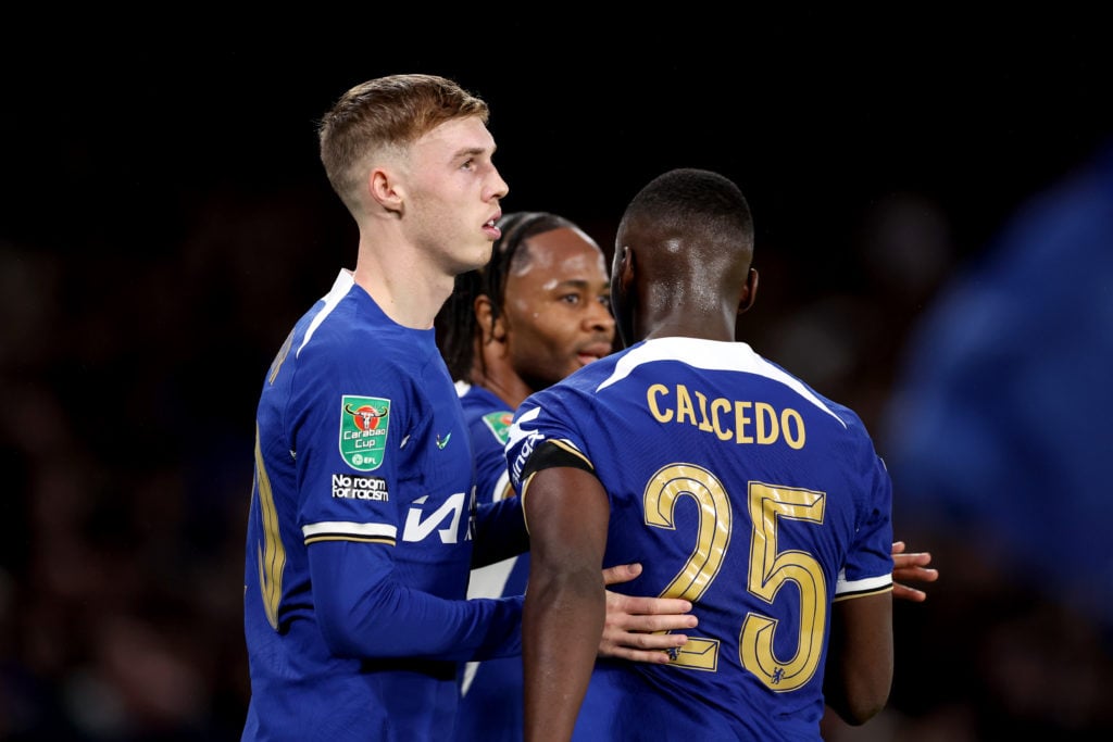 Cole Palmer of Chelsea celebrates scoring his team's fourth goal with teammates Moises Caicedo and Raheem Sterling during the Carabao Cup Semi Fina...