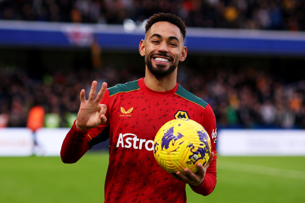 Matheus Cunha of Wolverhampton Wanderers poses with the match ball after scoring a hat-trick during the Premier League match between Chelsea FC and...