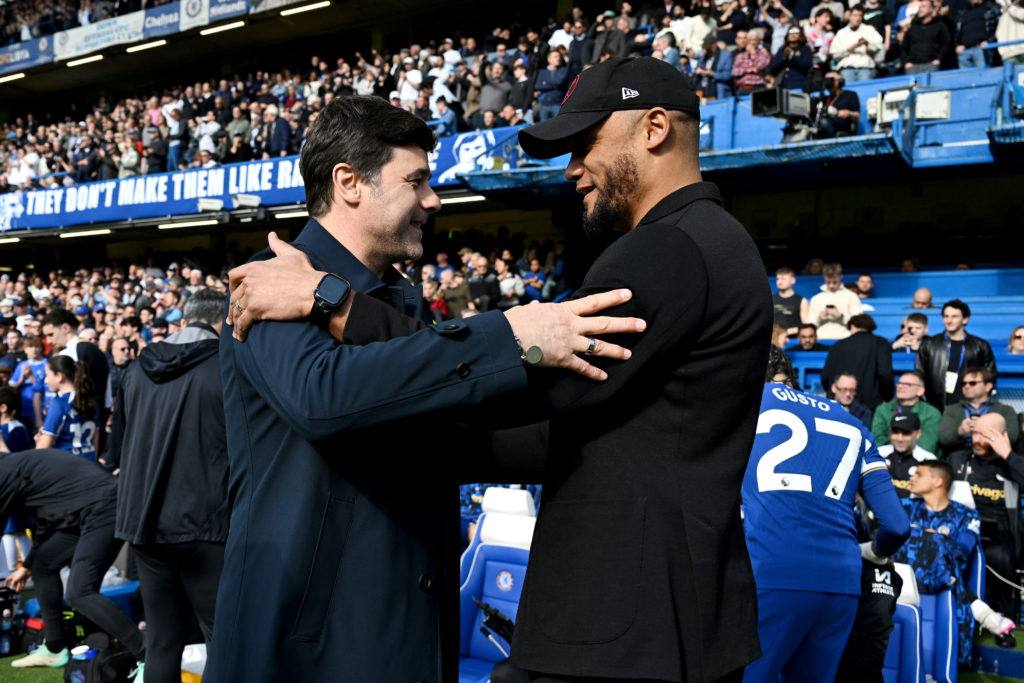 Mauricio Pochettino, Manager of Chelsea, and Vincent Kompany, Manager of Burnley, interact prior to the Premier League match between Chelsea FC and...