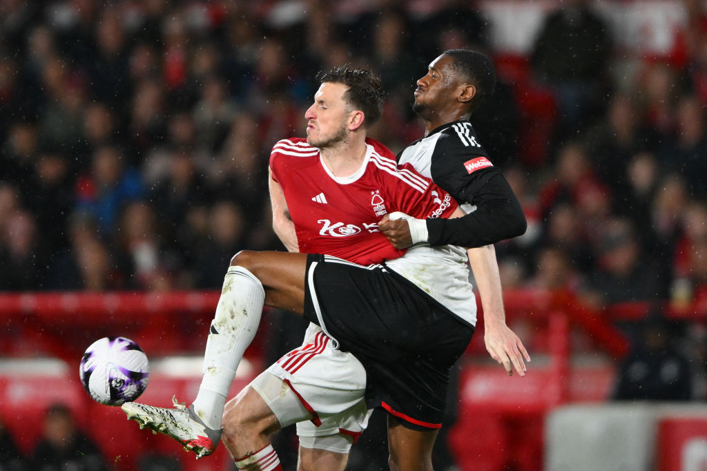 Tosin Adarabioyo is battling with Chris Wood of Nottingham Forest during the Premier League match between Nottingham Forest and Fulham at the City ...