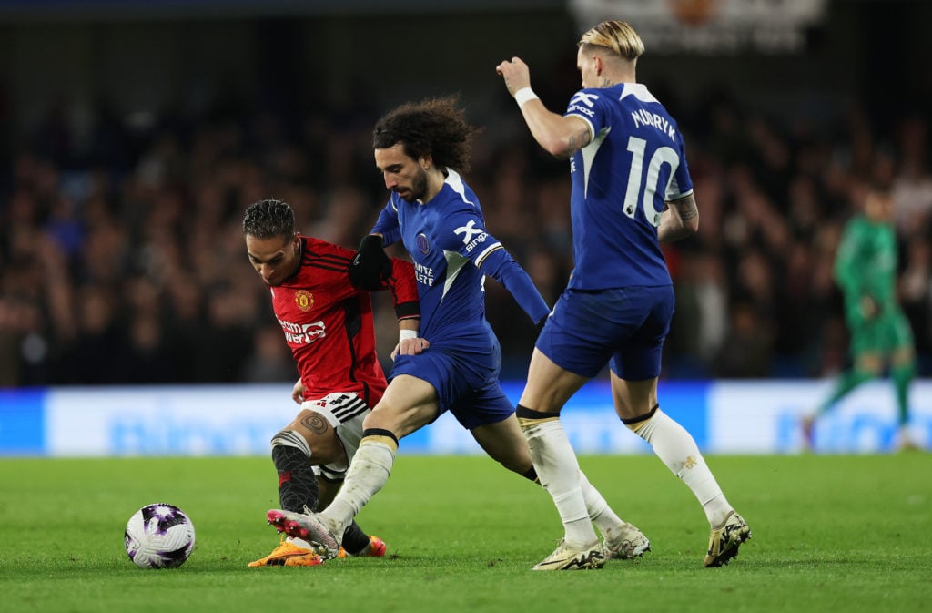 Antony of Manchester United is challenged by Marc Cucurella of Chelsea as Mykhaylo Mudryk looks on during the Premier League match between Chelsea ...