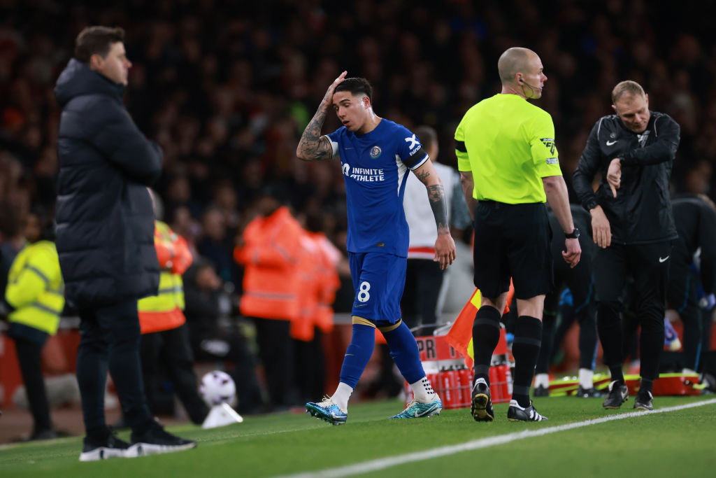 Enzo Fernandez of Chelsea reacts as he is substituted as Chelsea Head Coach Mauricio Pochettino looks on during the Premier League match between Ar...