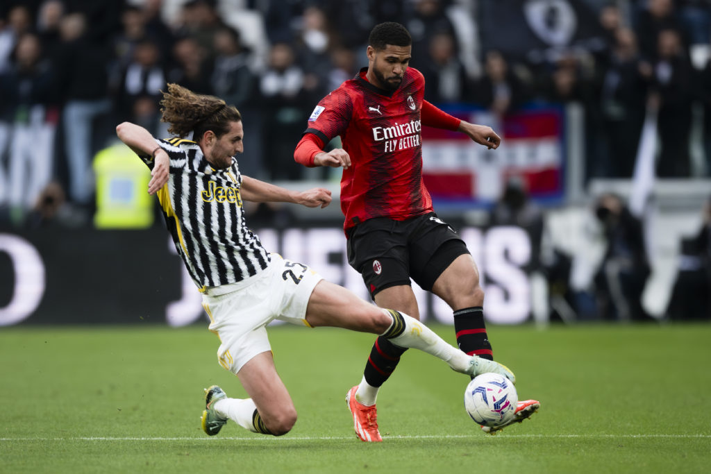 Ruben Loftus-Cheek (R) of AC Milan is tackled by Adrien Rabiot of Juventus FC during the Serie A football match between Juventus FC and AC Milan. T...
