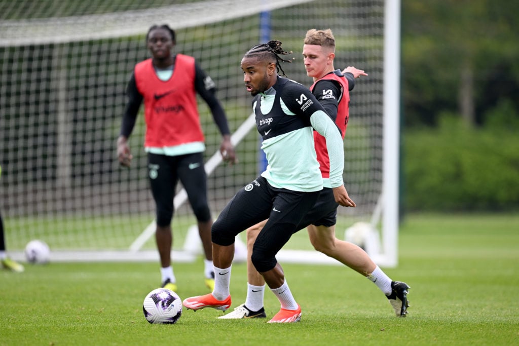 Christopher Nkunku and Jimi Tauriainen of Chelsea during a training session at Chelsea Training Ground on May 1, 2024 in Cobham, England.