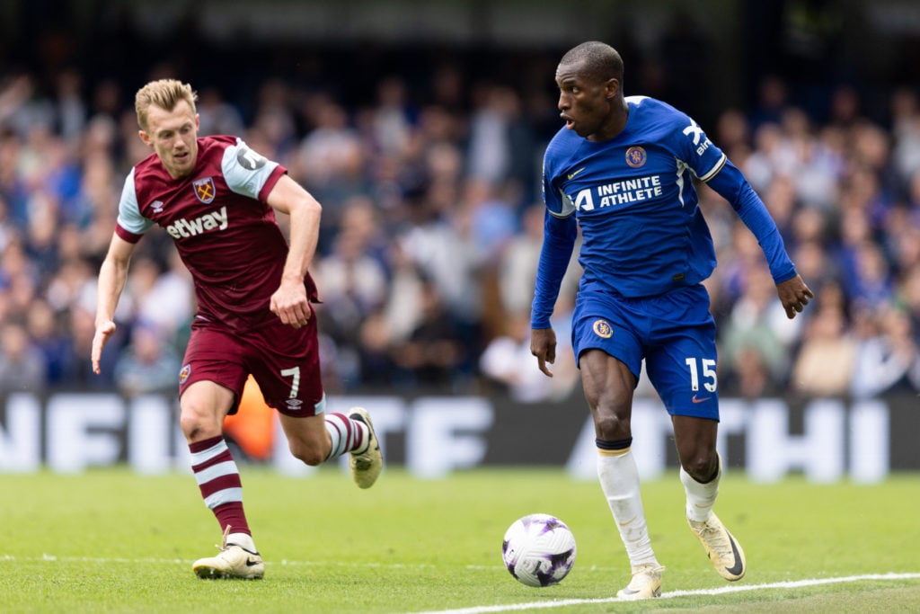 Nicolas Jackson of Chelsea is challenged by James Ward-Prowse of West Ham United during the Premier League match between Chelsea FC and West Ham Un...