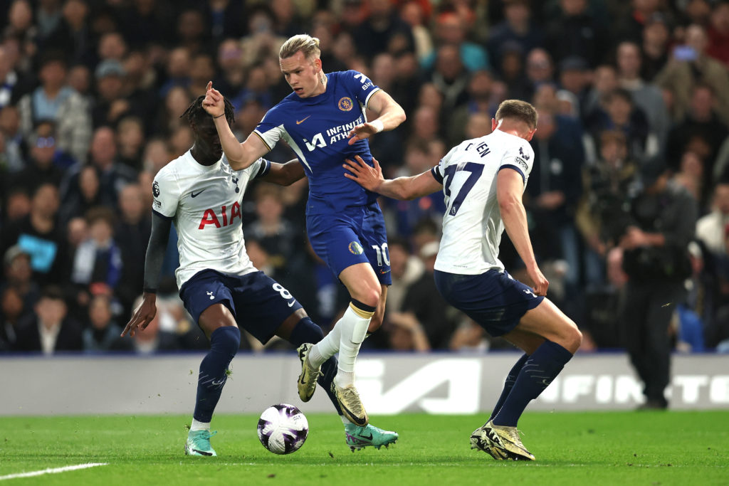 Mykhaylo Mudryk of Chelsea is challenged by Yves Bissouma and Micky van de Ven of Tottenham Hotspur during the Premier League match between Chelsea...
