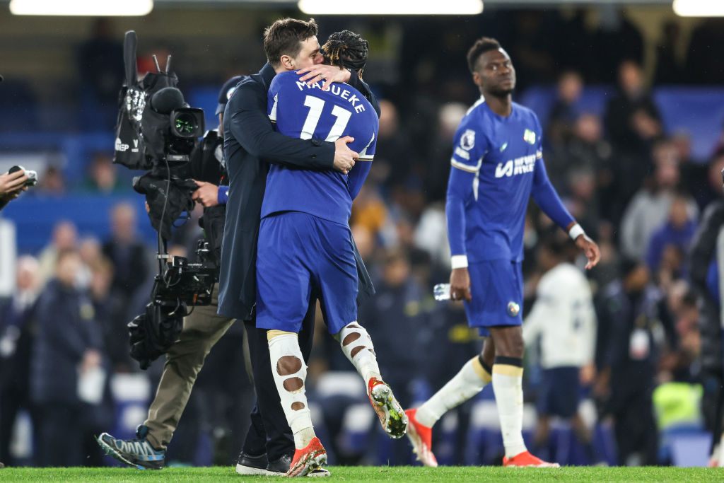Head Coach Mauricio Pochettino with Noni Madueke of Chelsea after their sides 2-0 win during the Premier League match between Chelsea FC and Totten...