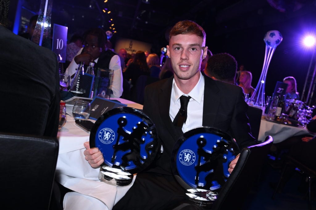 Cole Palmer of Chelsea with his two awards for Chelsea Player of the Year, and Chelsea Players' Player of the Year during the Chelsea FC 2024 Award...