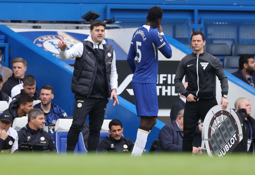 Mauricio Pochettino the head coach / manager of Chelsea speaks with Benoit Badiashile of Chelsea  during the Premier League match between Chelsea F...