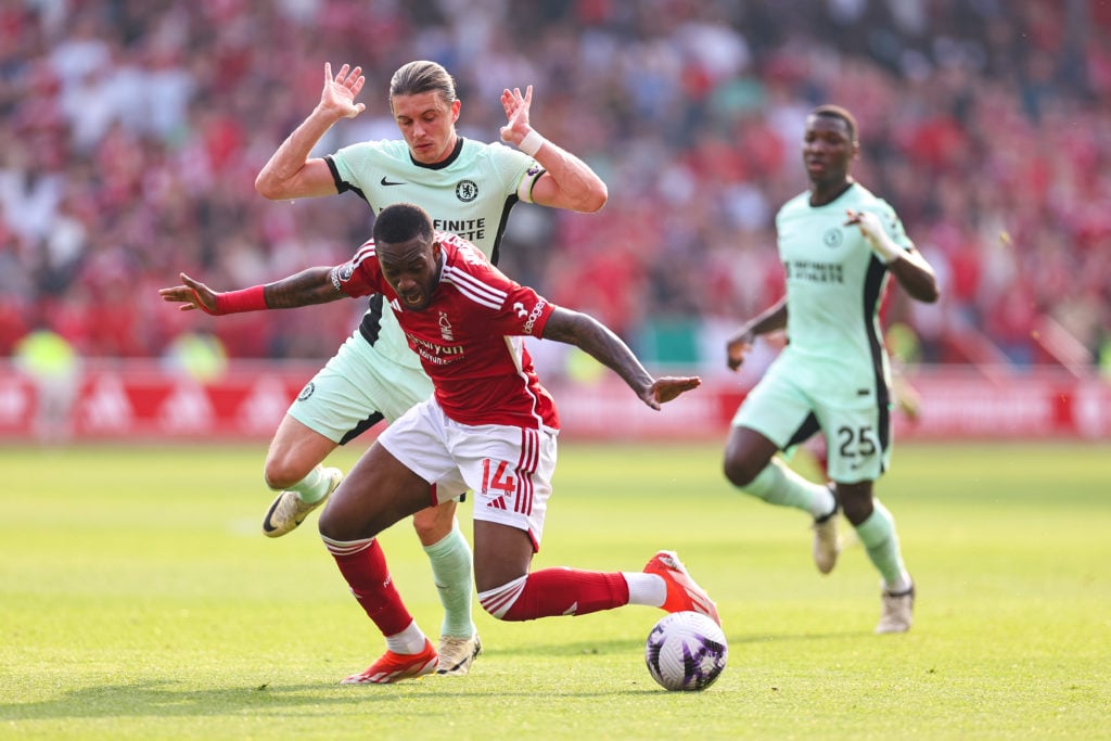 Conor Gallagher of Chelsea brings down Callum Hudson-Odoi of Nottingham Forest during the Premier League match between Nottingham Forest and Chelse...