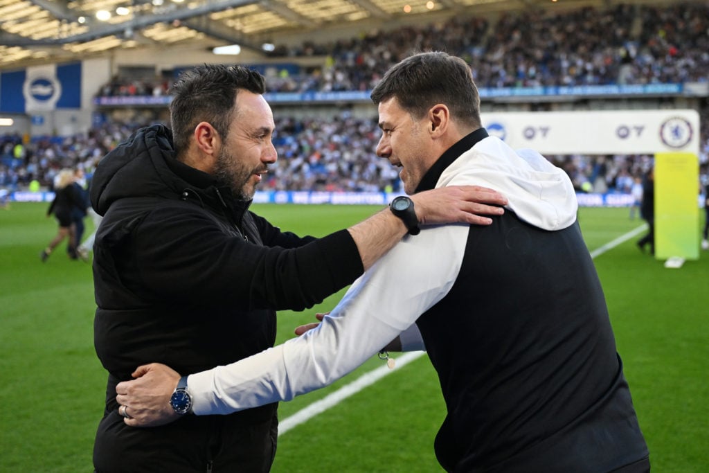 Roberto De Zerbi, Manager of Brighton & Hove Albion, and Mauricio Pochettino, Manager of Chelsea, embrace prior to the Premier League match bet...