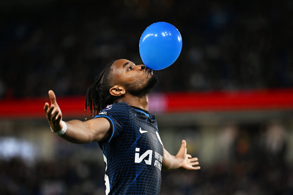 Christopher Nkunku of Chelsea celebrates scoring his team's second goal with a balloon during the Premier League match between Brighton & Hove ...