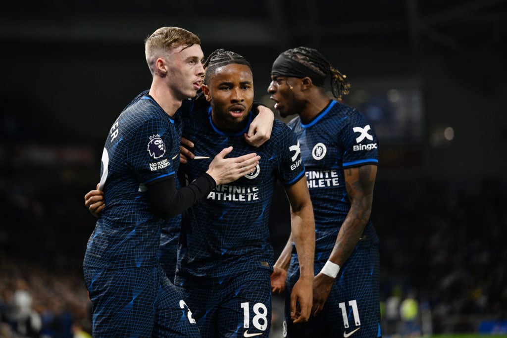 Christopher Nkunku of Chelsea celebrates scoring his team's second goal with teammate Cole Palmer during the Premier League match between Brighton ...