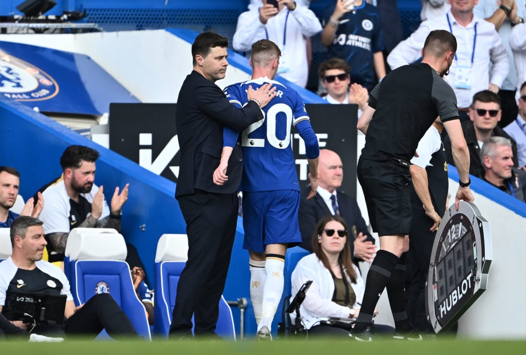 Cole Palmer of Chelsea embraces Mauricio Pochettino, Manager of Chelsea as he is substituted  during the Premier League match between Chelsea FC an...