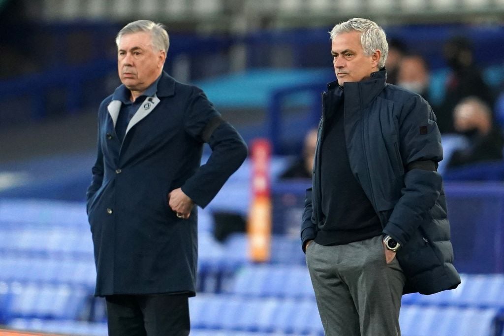 Everton's Italian head coach Carlo Ancelotti (L) and Tottenham Hotspur's Portuguese head coach Jose Mourinho watches his players from the touchline...