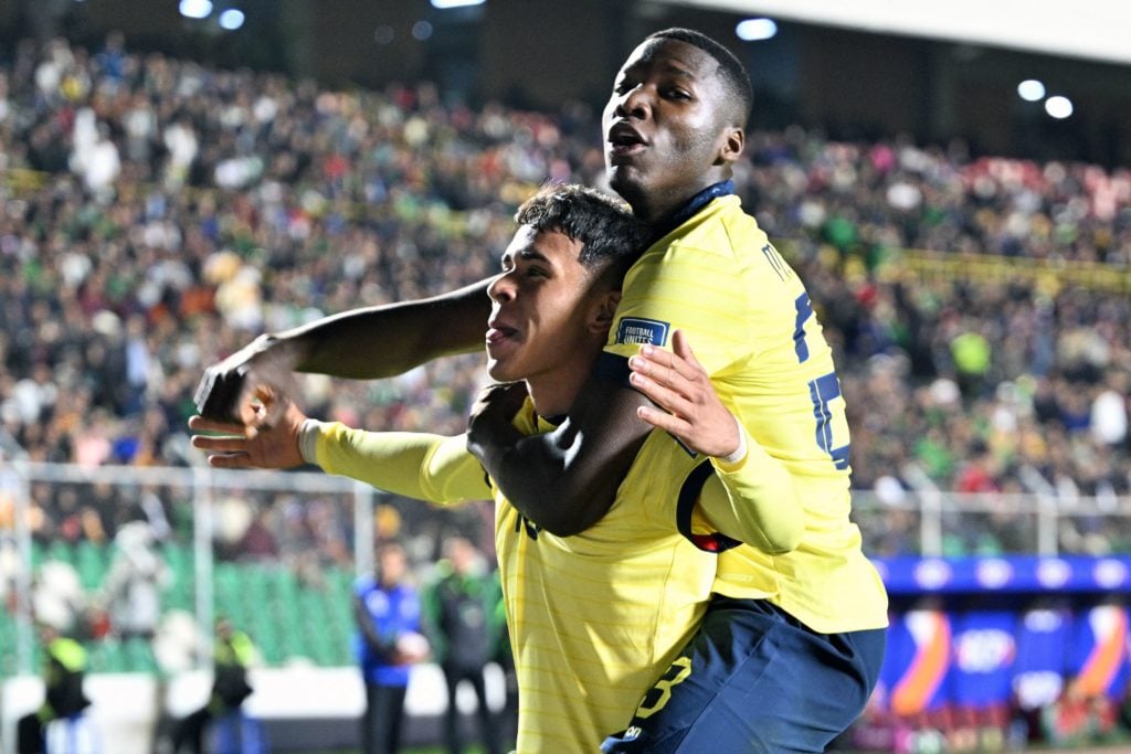 Ecuador's midfielder Kendry Paez (L) celebrates with Ecuador's midfielder Moises Caicedo after scoring during the 2026 FIFA World Cup South America...