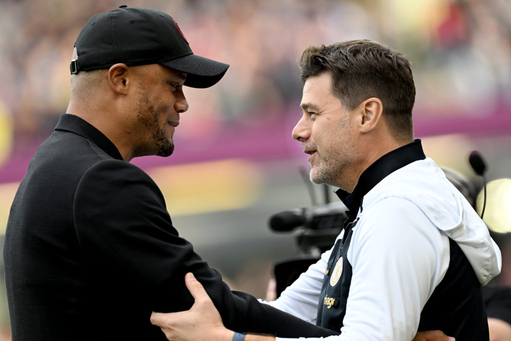 Vincent Kompany, Manager of Burnley, interacts with Mauricio Pochettino, Manager of Chelsea, prior to the Premier League match between Burnley FC a...