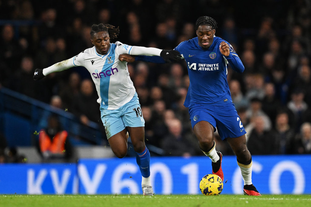 Axel Disasi of Chelsea runs with the ball whilst under pressure from Eberechi Eze of Crystal Palace during the Premier League match between Chelsea...