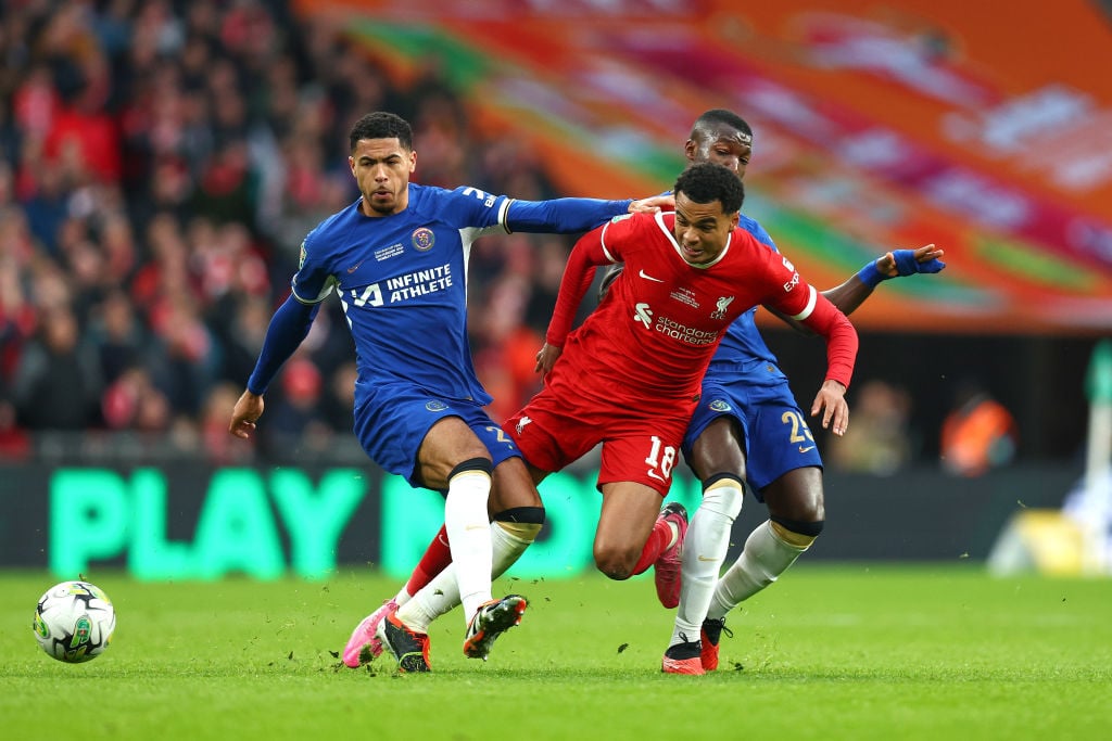 Cody Gakpo of Liverpool is surrounded by Levi Colwill and Moises Caicedo of Chelsea during the Carabao Cup Final match between Chelsea and Liverpoo...
