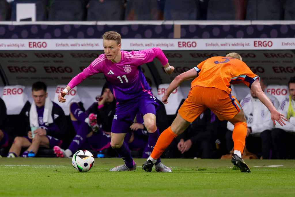 Chris Fuhrich of Germany and Matthijs de Ligt of Netherlands battle for the ball during the friendly match between Germany and Netherlands at Deuts...