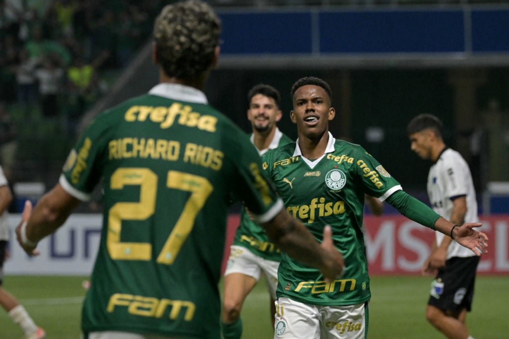 Palmeiras' forward Estevao Willian celebrates with teammate Colombian midfielder Richard Rios after scoring a goalfight for the ball during the Cop...