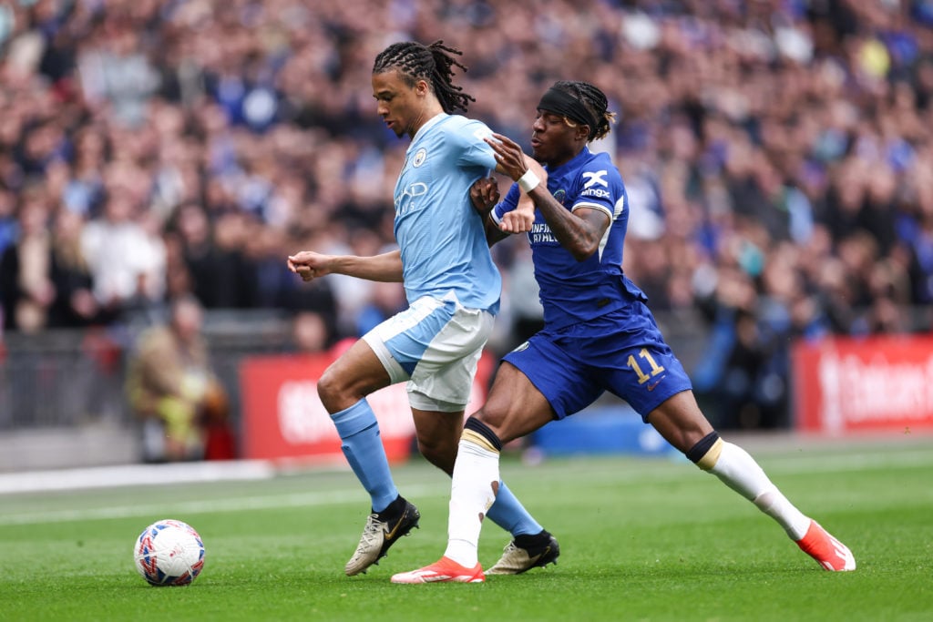 Nathan Ake of Manchester City and Noni Madueke of Chelsea during the Emirates FA Cup Semi Final match between Manchester City and Chelsea at Wemble...