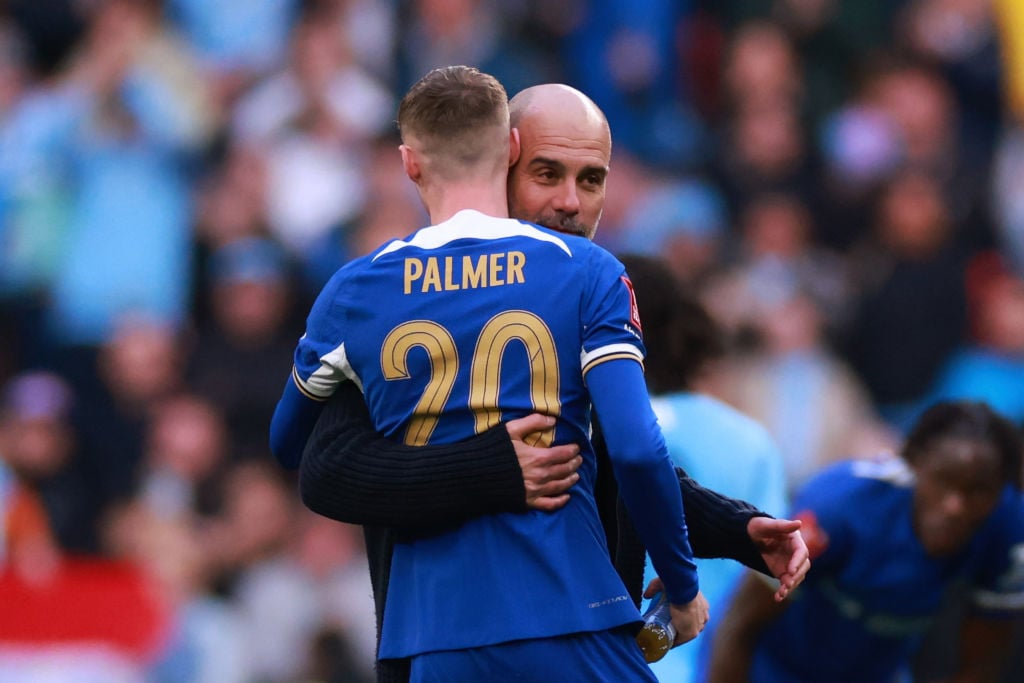 Cole Palmer of Chelsea with Pep Guardiola manager of Manchester City during the Emirates FA Cup Semi Final match between Manchester City and Chelse...